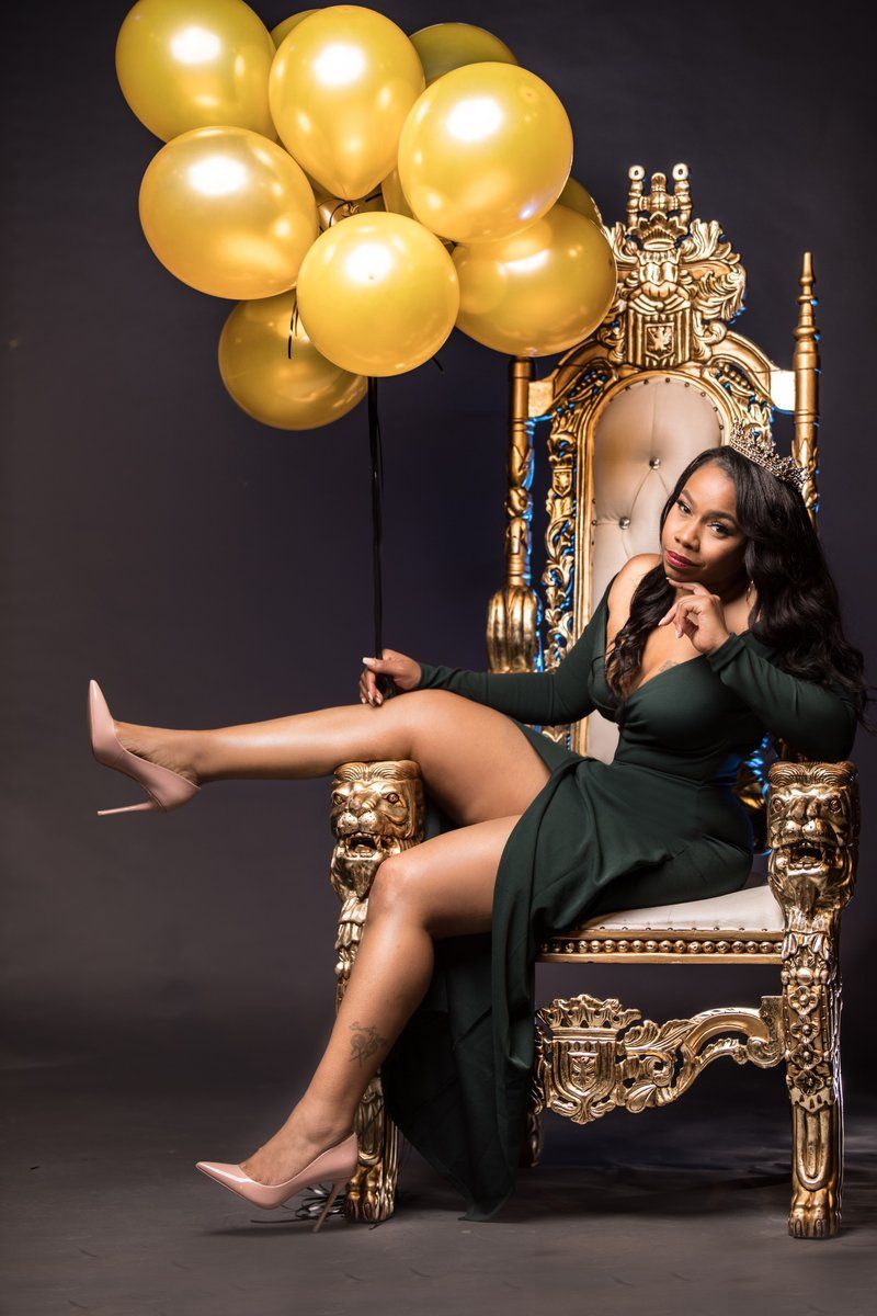 Birthday portrait on a gold throne with balloons